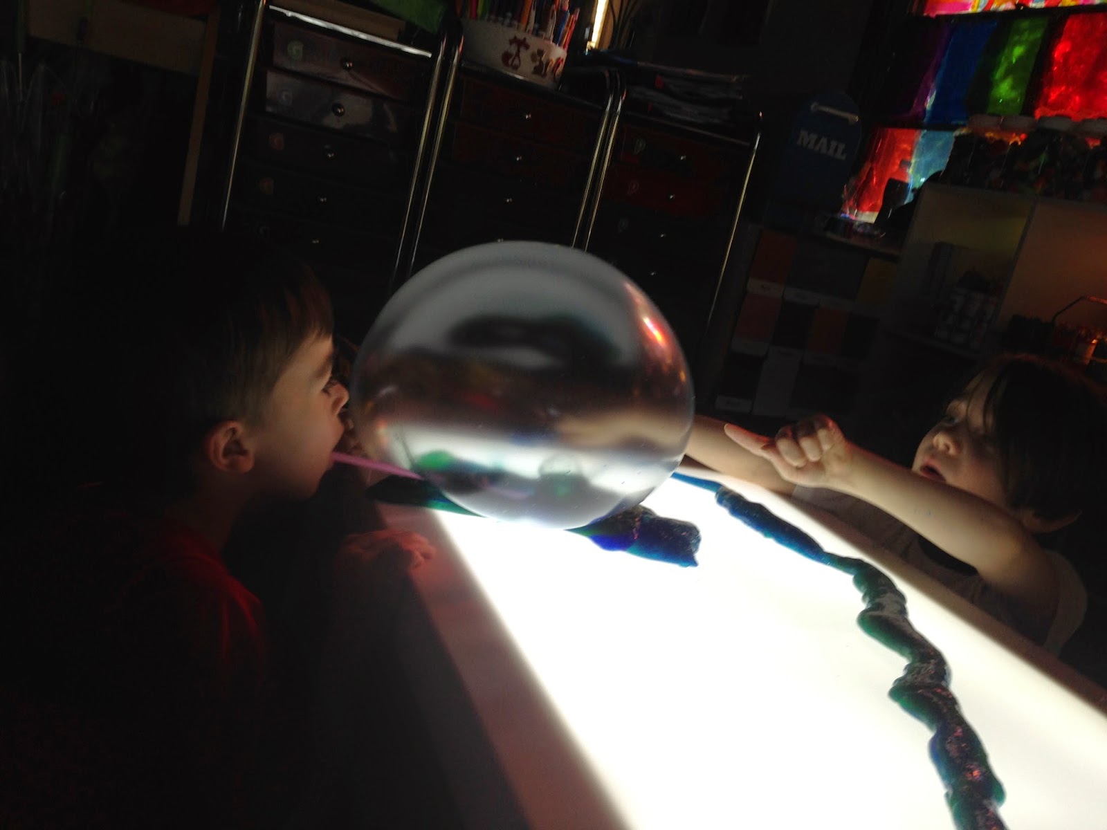silly putty, straws, and light table