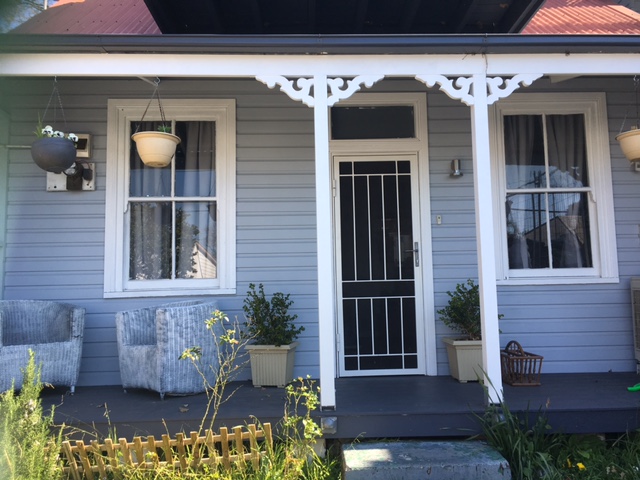 The Crooked Cottage New weatherboards and verandah decking