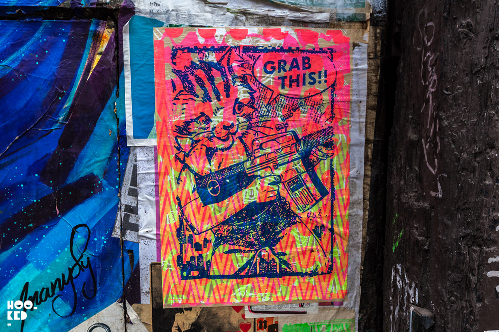Cat with gun, Street Art Paste-ups in London by artist Zombiesqueegee