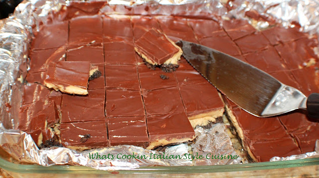 these are a no bake peanut butter oreo cookie bar. The have a layer of oreo cookies crushed with peanut butter filling and chocolate ganache topping. Brownies gourmet style and easy to make because they are a no bake brownie bar almost like a candy bar with cookie bottom