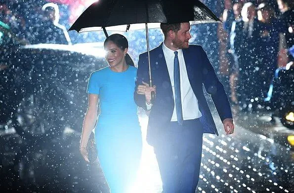 Meghan Markle wore Victoria Beckham pencil midi dress. Meghan, Duchess of Sussex and Prince Harry, Duke of Sussex
