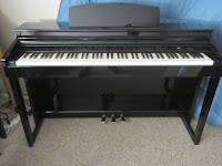 Artesia DP150e, AG30, AG50 digital pianos - azpianonews.com picture of Artesia polished ebony piano