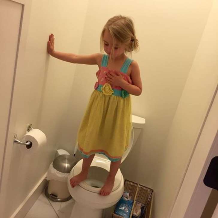 Photo Of Little Girl Standing On A Toilet Sit G