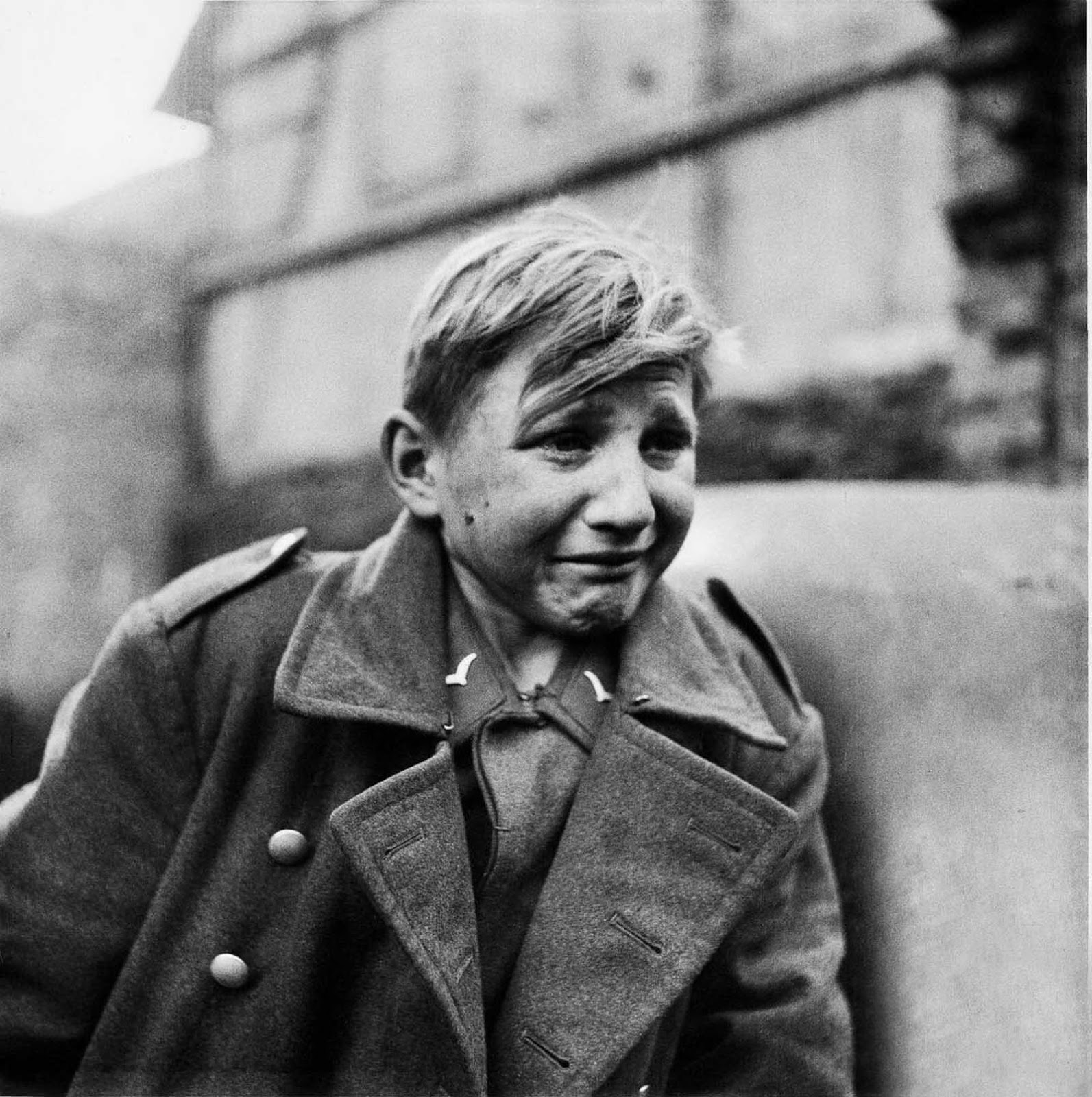 A fifteen year old German soldier, Hans-Georg Henke, cries being captured by the US 9th Army in Germany on April 3, 1945