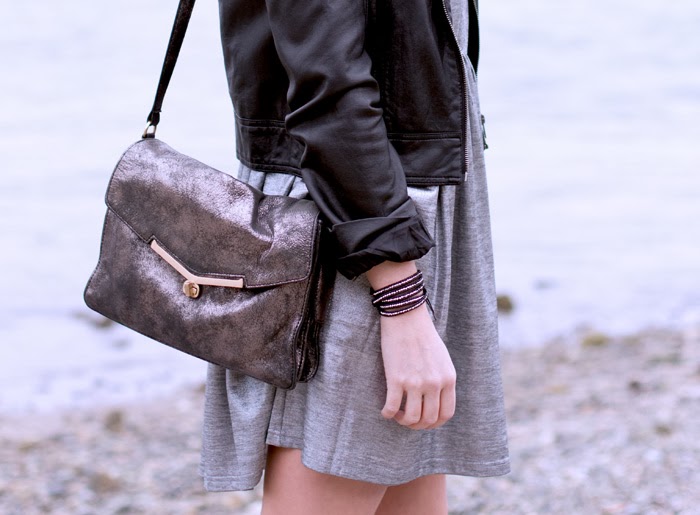 Vancouver Fashion Blogger, Alison Hutchinson, is wearing a MinkPink silver dress, Forever 21 leather jacket, Topshop western boots, botkier valentina bag, and a privilege clothing bracelet