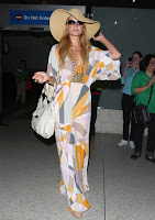 Paris Hilton strikes a pose in a retro dress at LAX airport