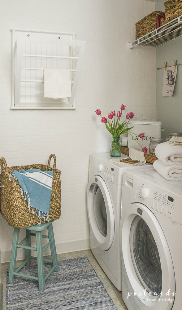 white laundry room with blue rug