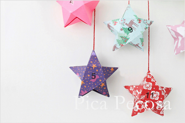 calendario-adviento-diy-trozo-madera-pinzas-ropa-adornadas-washi-tape-cajas-papel-forma-estrella