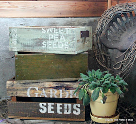 use reclaimed wood crates in the garden to hold plants