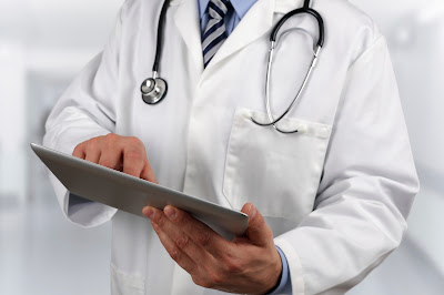 Doctor looking at medical chart