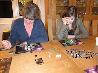 Galaxy Trucker - The ladies examining their respective space crafts