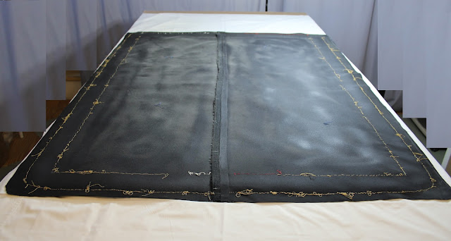 Reverse of old flag mount, dust covers the cloth Old flag mount, conservation, pressure mount benefits, textile conservator, flag conservation, preservation, repair