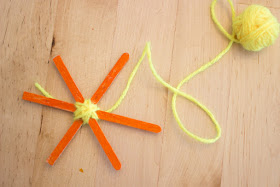 smiley sun popsicle stick weaving- great Summer kids craft!
