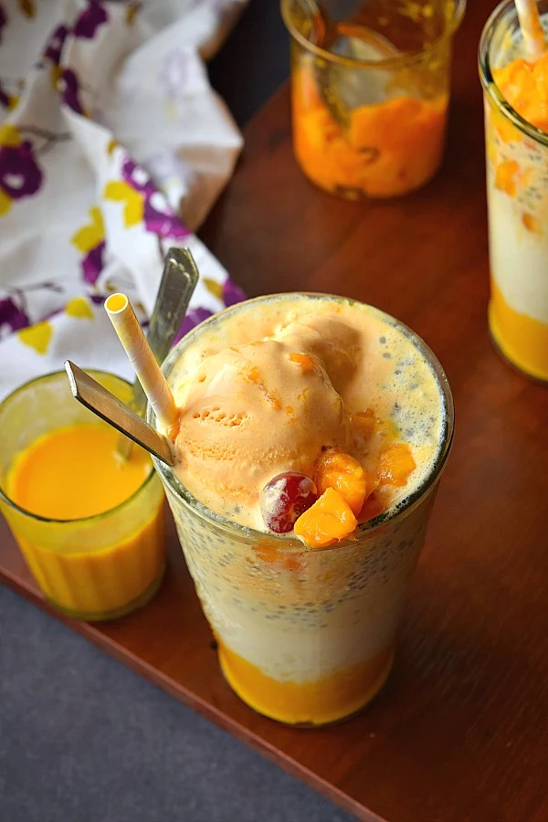 Top view of a glass served with delicious,cooling Summer favorite Mango Falooda,Mango chunks and cherry!