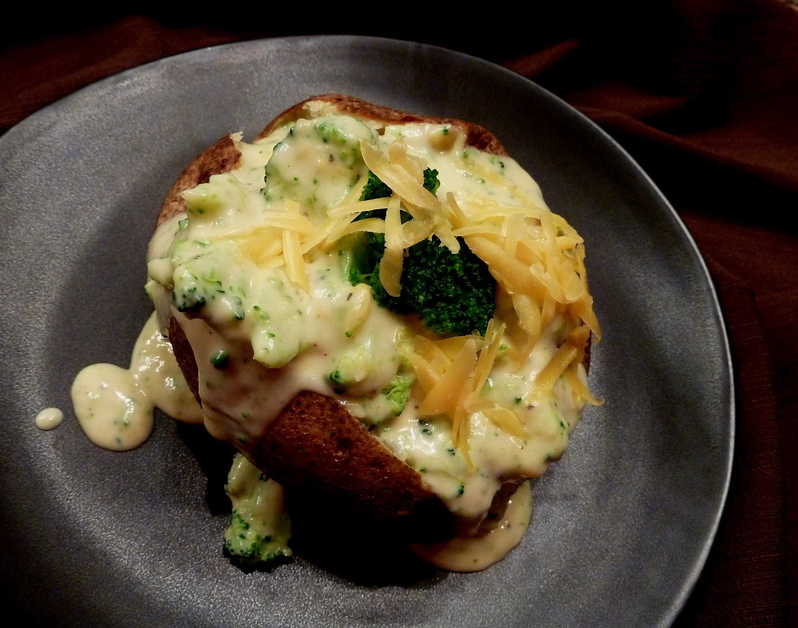 Cracked Pepper Baked Potatoes with Broccoli Cheese Sauce