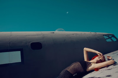 woman laying on airplane, neon red hair, model algelika kocheva, jamie nelson photographer