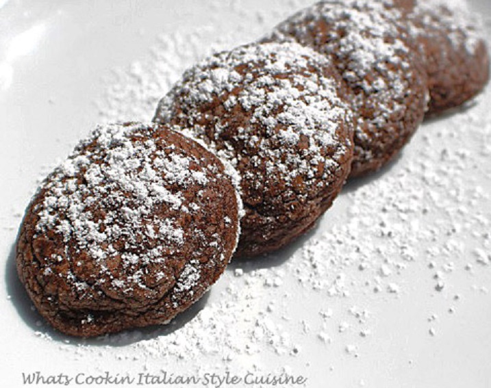 These are a chocolate peanut butter easy cookie made with peanut butter with powdered sugar on top on a white plate a semi homemade recipe with simple ingredients