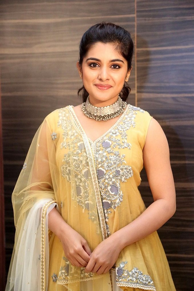 Beautiful Telugu Girl Niveda Thomas Long Hair Photos In Yellow Dress