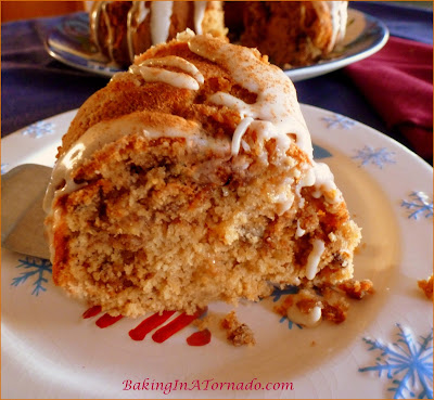 Sweet Potato Pecan Cake with Maple Glaze, a moist holiday cake with a hint of sweet potato, a cinnamon ,maple swirl center and a hint of maple maple in the glaze. | Recipe developed by www.BakingInATornado.com | #recipe #cake #holiday