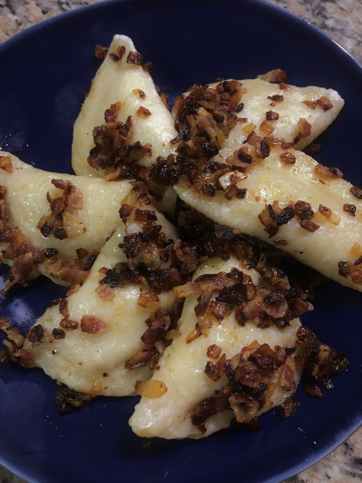 Potato and Sauerkraut Pierogies with Bacon and Caramelized Onions