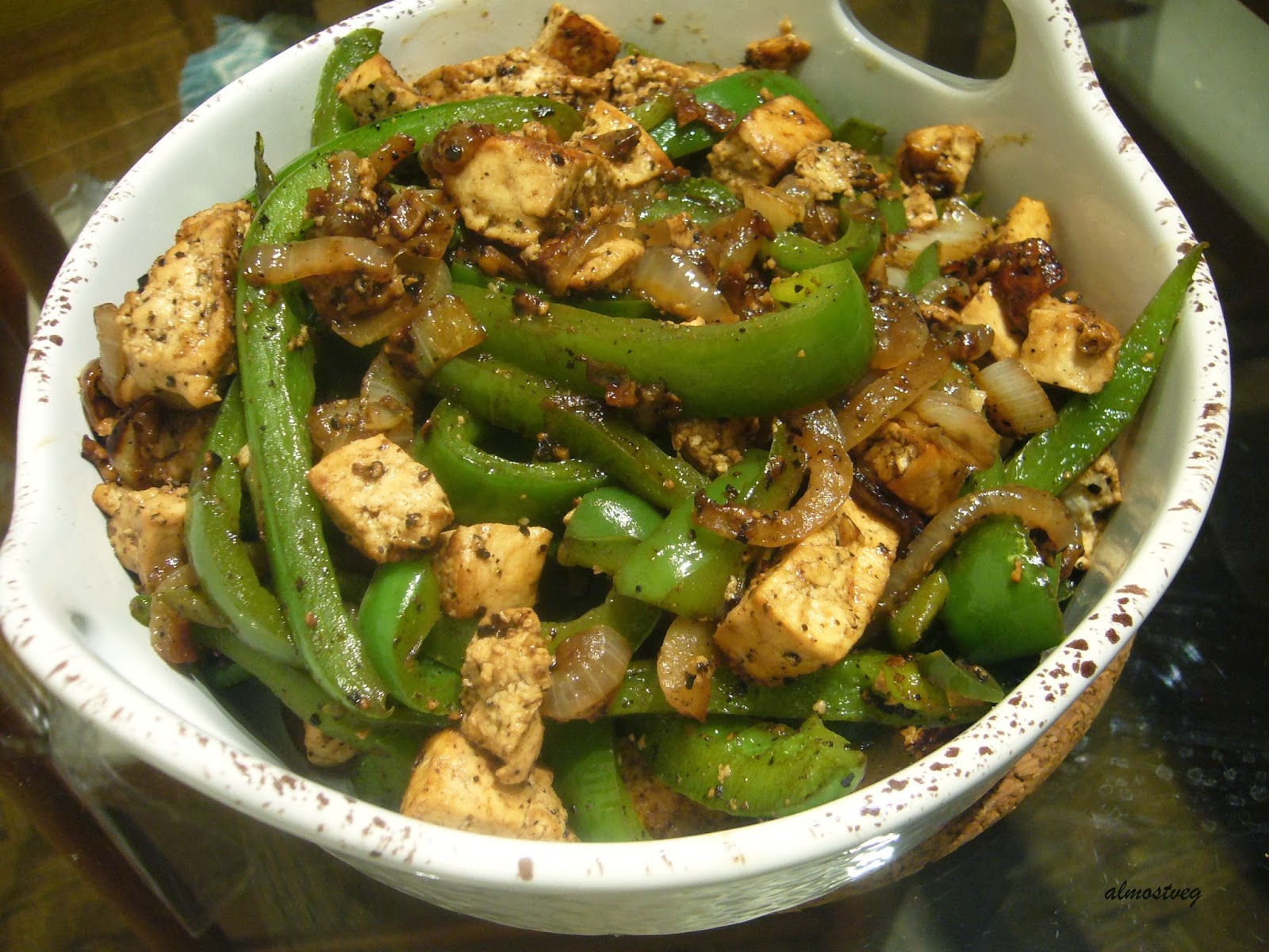 Black pepper tofu with onion and bell peppers
