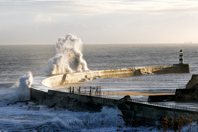 Seaham lighthouse with stormy waves in the morning