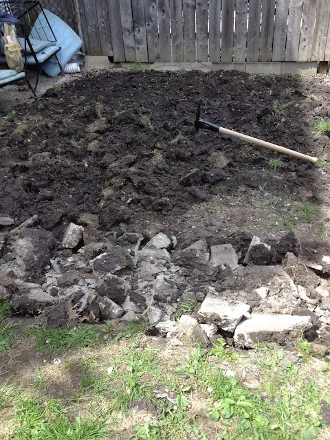 turning over dirt for patio