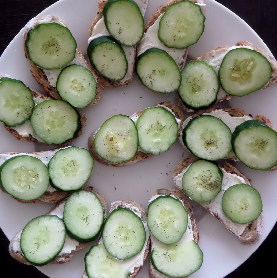 Cucumber Bites:  Crisp, fresh, cucumber slices on baguette spread with cheese.