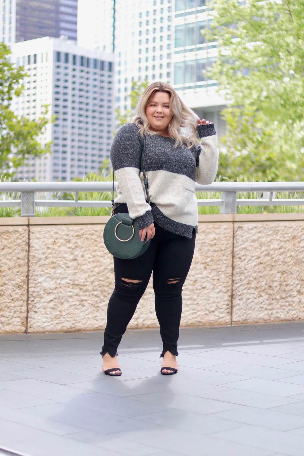Chicago Plus Size Petite Fashion Blogger, influencer, YouTuber, and model Natalie Craig, of Natalie in the City, reviews Chic Soul's black skinny jeans and oversized fall sweater.