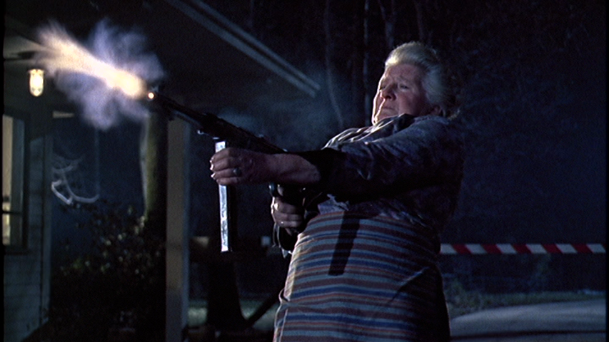 Goldfinger-Varley-Thomas-little-old-lady-machine-gun-gatekeeper.png