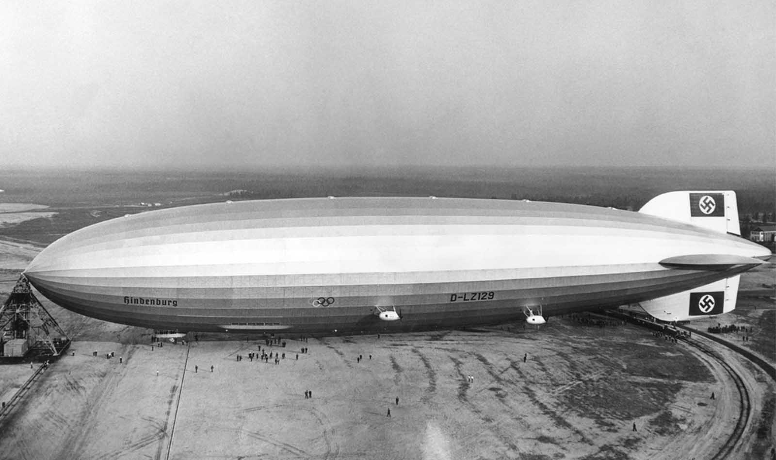 The giant German zeppelin Hindenburg, in Lakehurst, New Jersey, in May of 1936. The Olympic rings on the side were promoting the 1936 Berlin Summer Olympics.