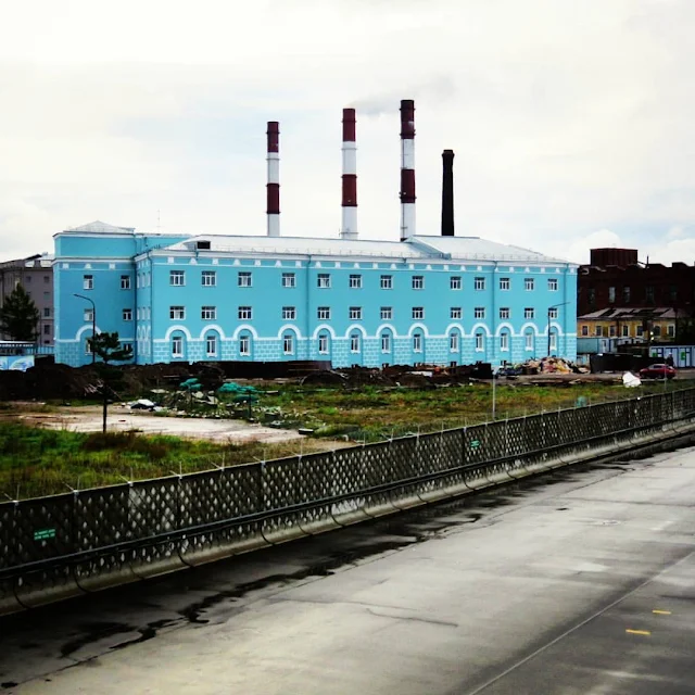 Blue building and smokestacks in St. Petersburg, Russia