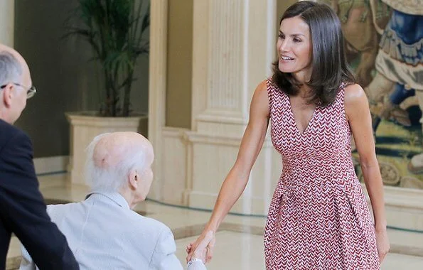 Queen Letizia wore a v-neck zig-zag print midi dress by Carolina Herrera and Lodi burgundy suede ankle strap pumps