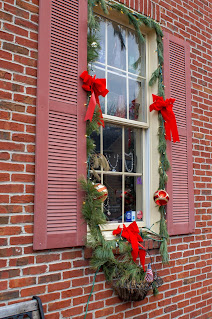 Christmas decorations around window in St. Charles, Missouri photo by mbgphoto