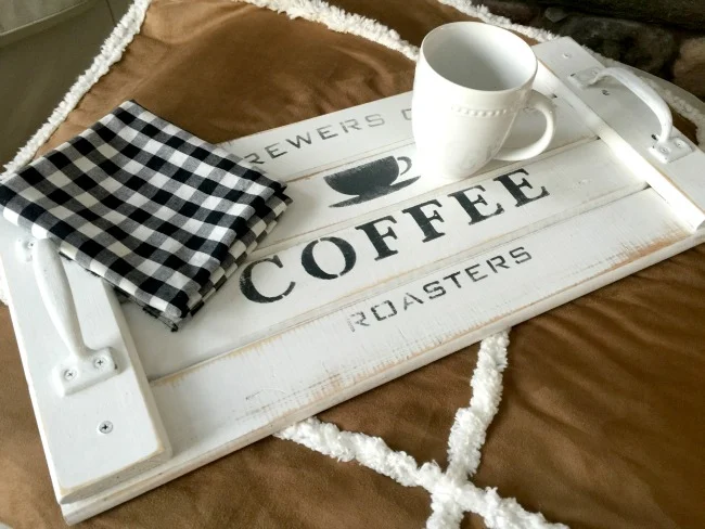 White stenciled coffee tray with coffee cup and napkin