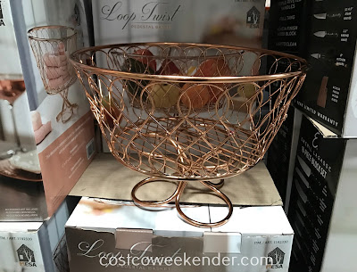 Have a practical vessel to place fruit in with the Vanderbilt Loop Twist Pedestal Basket