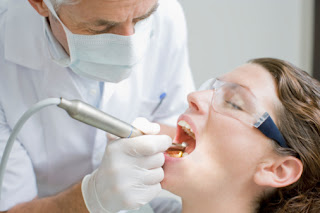 Dentist Examing Teeth