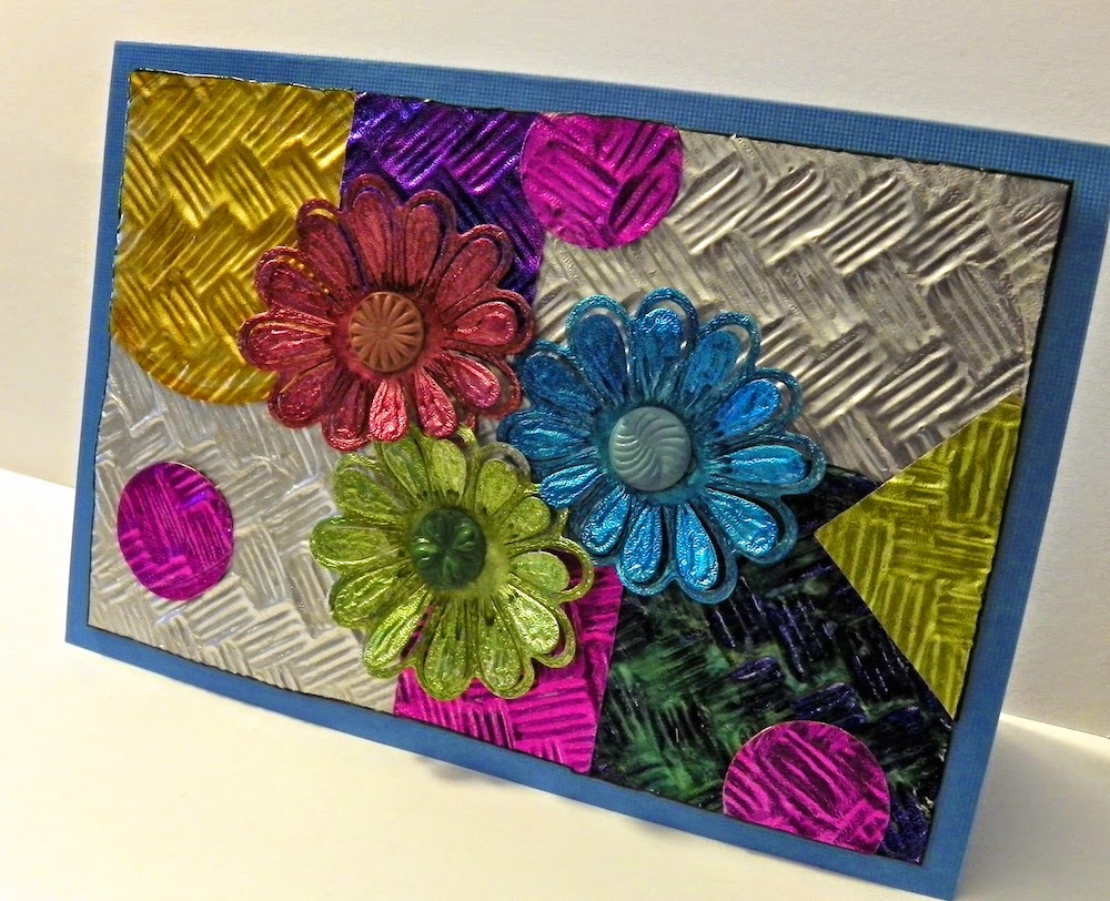 Handmade greeting card with recycled foil flowers