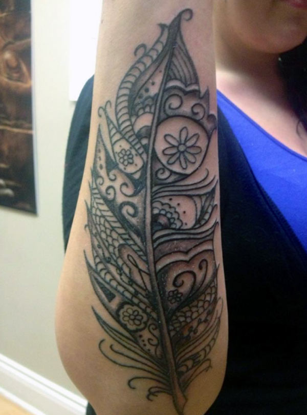 This is an amazing trendy feather tattoo with henna designs black and grey ink work tattoo designs This is an amazing trendy feather tattoo with henna designs black and grey ink work tattoo designs