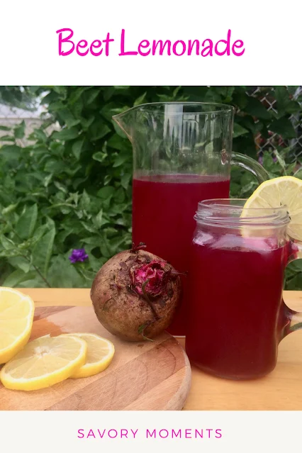 A pitcher and serving glass of beet lemonade.