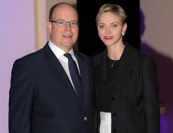Prince Albert and Princess Charlene of Monaco appear on the balcony of the prince's palace to celebrate Good Friday 
