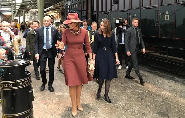 Queen Maxima wore Natan burgundy belted midi dress, and Delvigne hat, Natan pumps