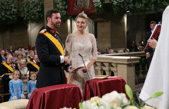 Princess Stephanie of Luxembourg and Crown Prince Guillaume of Luxembourg are seen exchanging rings during their wedding ceremony at the Cathedral of our Lady of Luxembourg