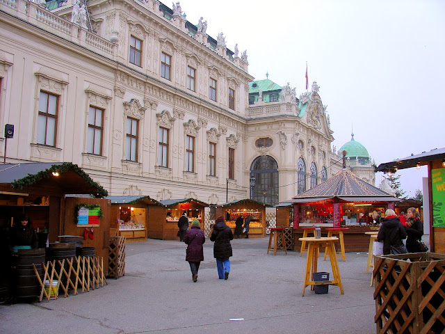 The Belvedere Palace and neighboring Christmas market in Vienna, Austria.