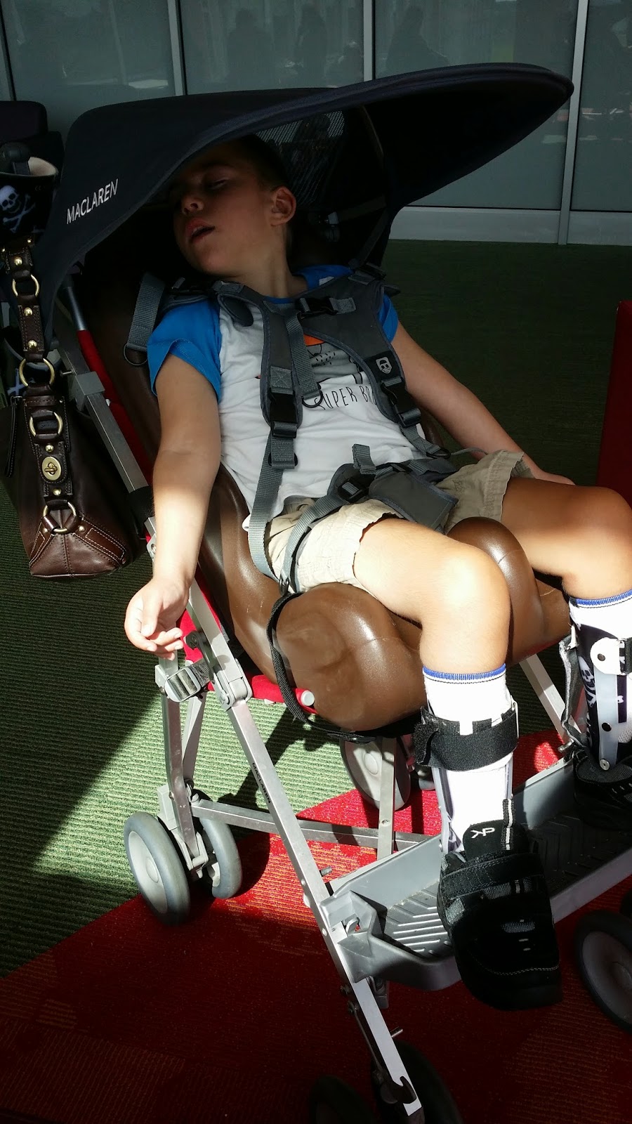 our Spastic Quad CP son in Macclaren Major stroller 