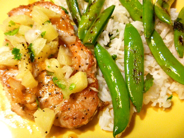 A light and tropical flavored dish of Pineapple Pork Chops with Snap Peas and Jasmine Rice.  Perfect for a summer weeknight meal. - Slice of Southern