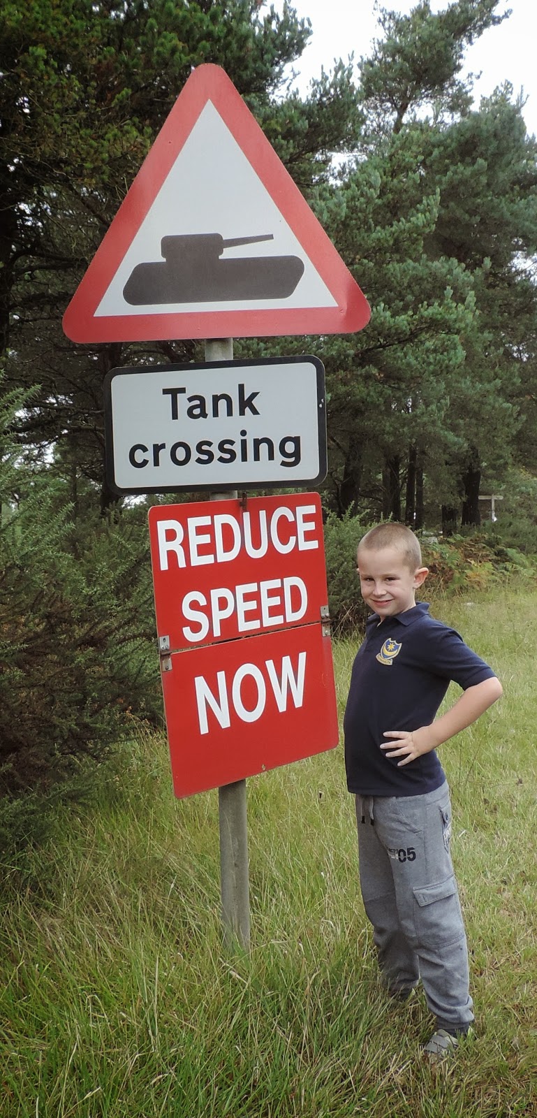 funny warning sign near tank museum bovington camp dorset