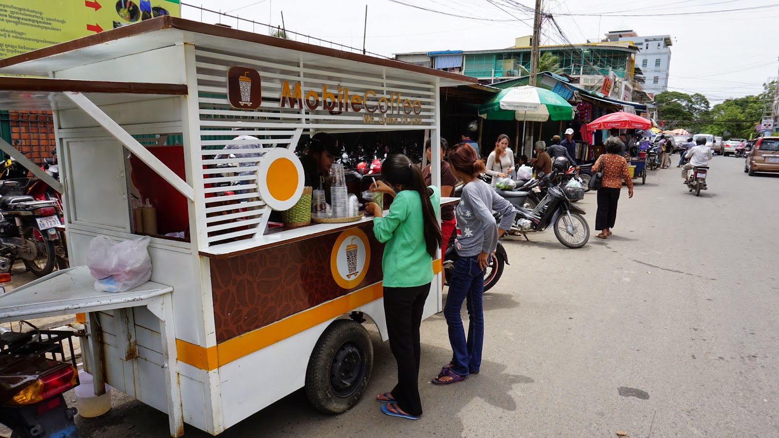 Getting my caffeine fix from a mobile coffee kiosk, just outside the Russian Market. This seems to be a popular franchise here in Cambodia