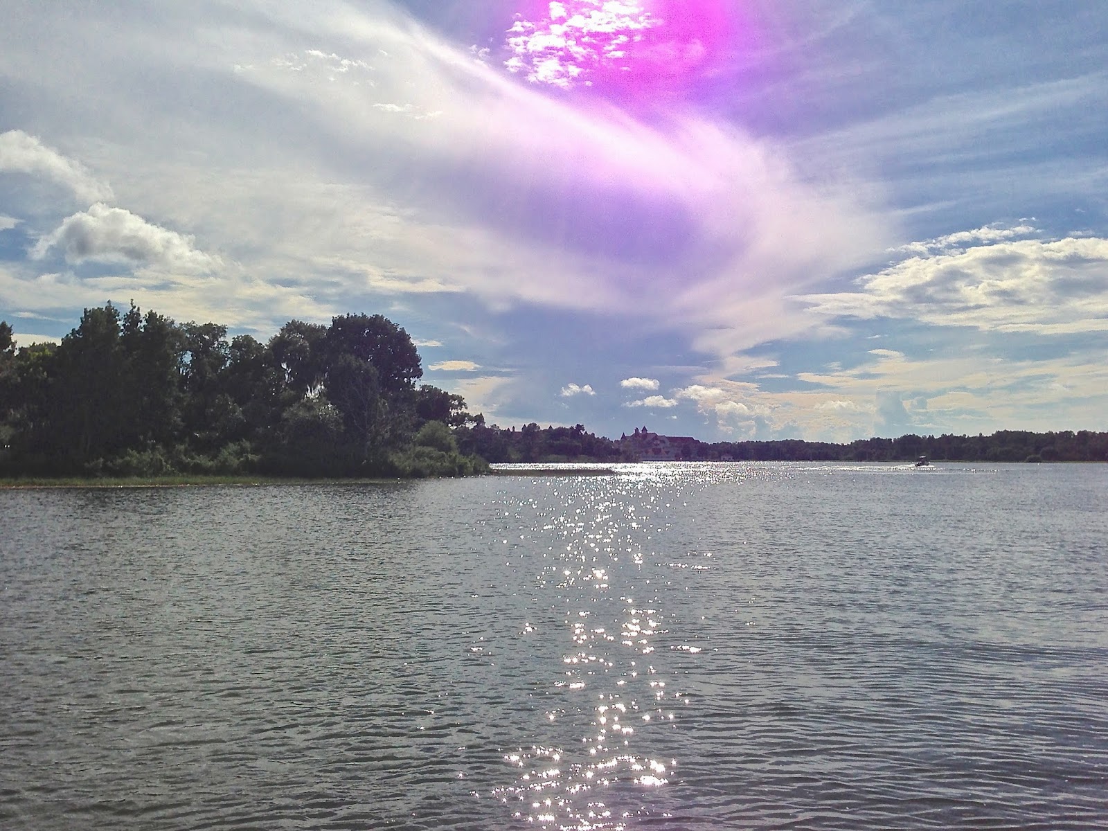 Lake and trees with blue sky