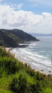 Views over the beach at Mangawhai Heads from the Goldschmidt Trail on the drive from Auckland to Paihia in the Bay of Islands New Zealand